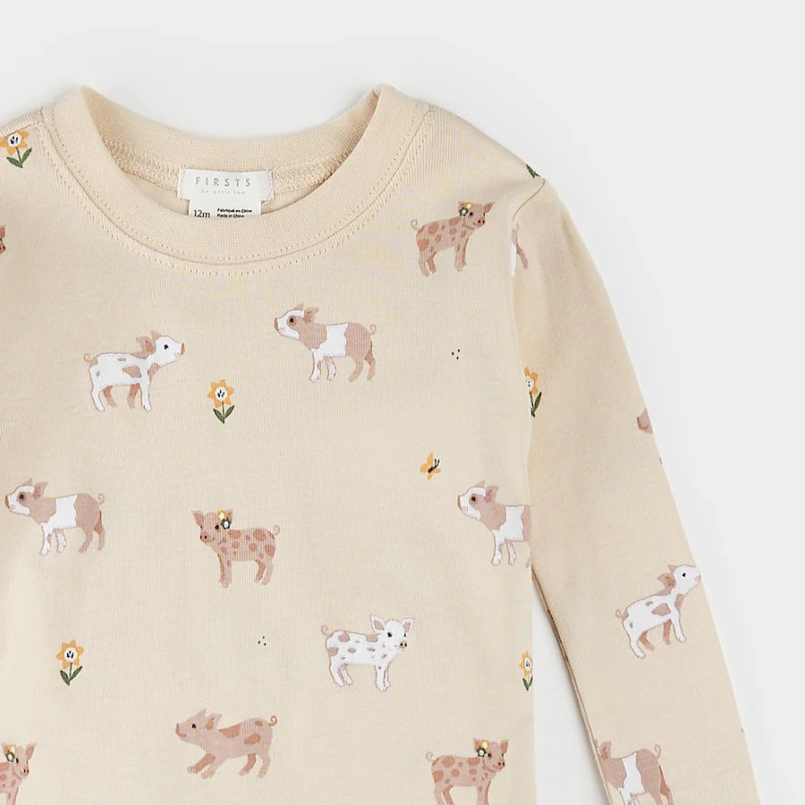 Porcelets sur pyjama blanc antique pour bébé