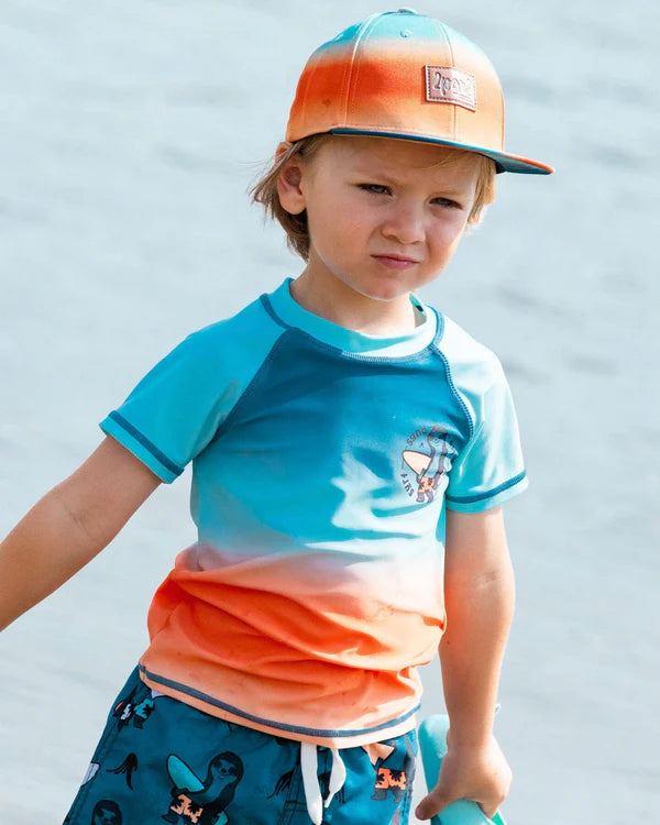 chandail maillot de bain à manches courtes bleu marine, turquoise et orange