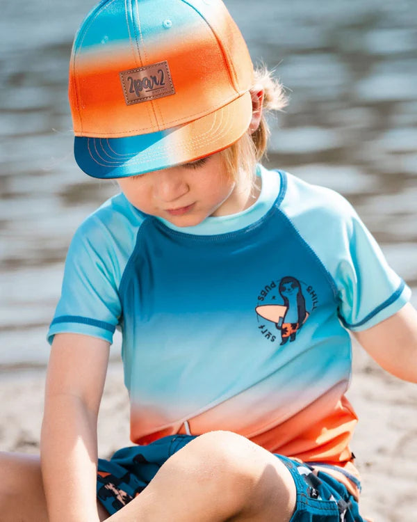 Casquette imprimée bleu marine, turquoise et orange