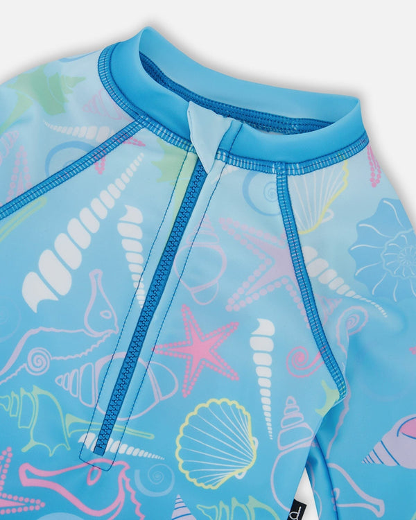 Rashguard à manches longues une-pièce bleu imprimé coquillages pour bébé et fillette
